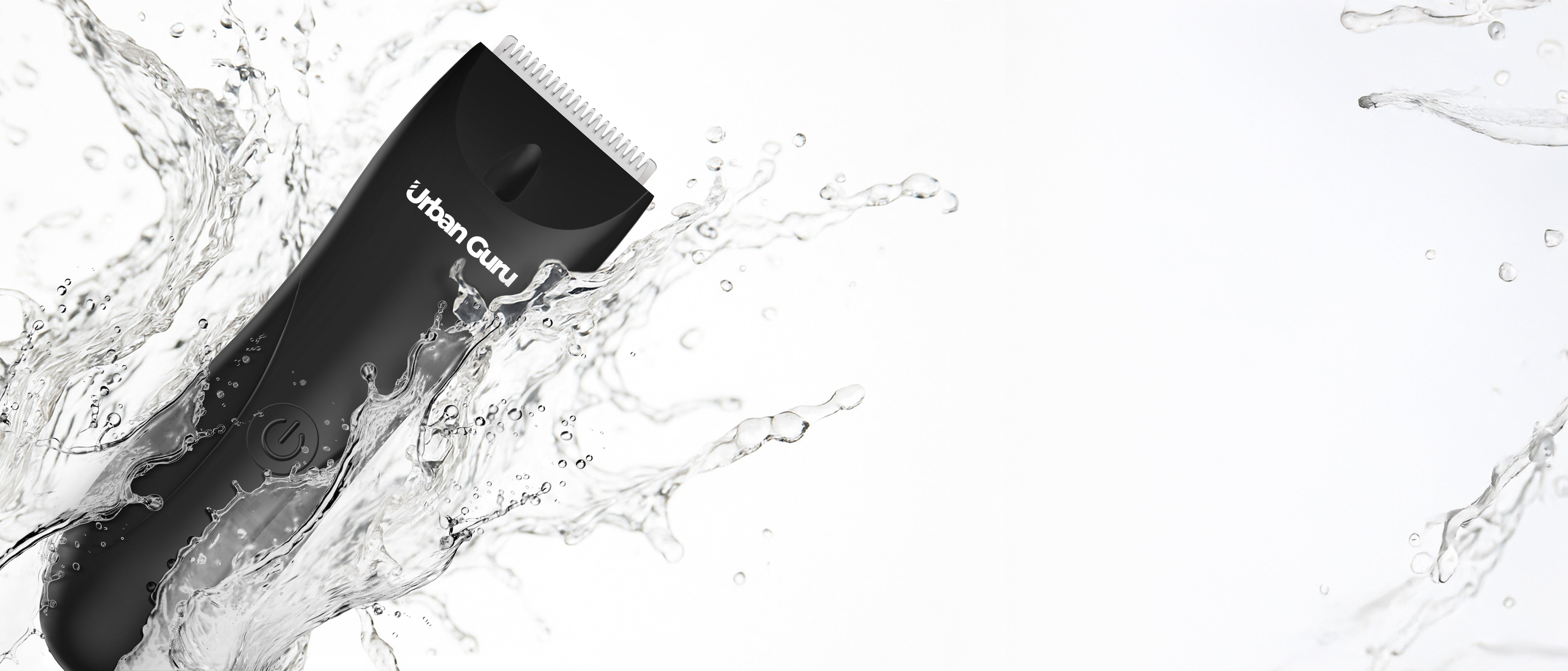 Black hair trimmer with 'Urban Guru' branding submerged in water on a white background