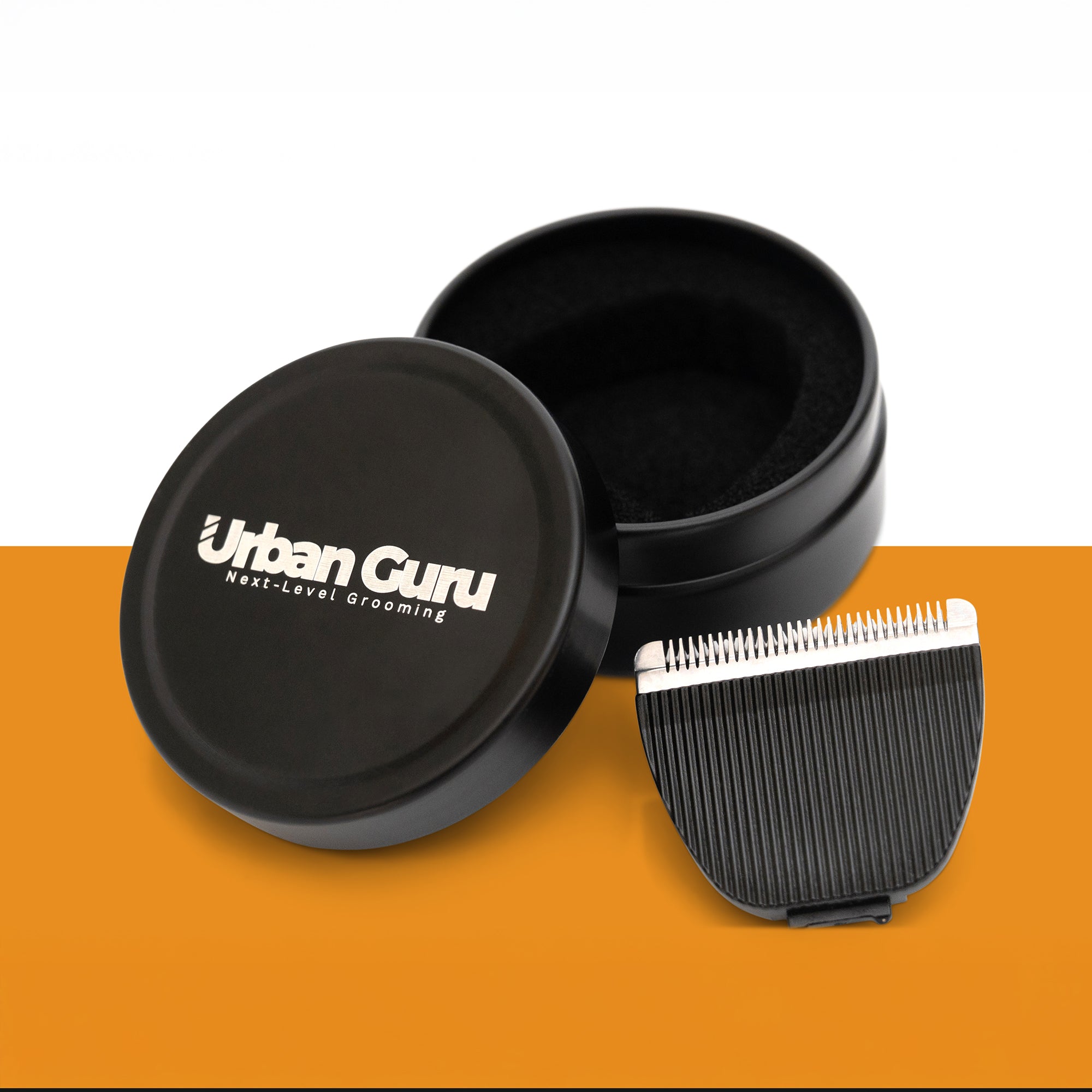 Black grooming comb with open lid displaying 'Urban Guru' branding on a white and orange background.