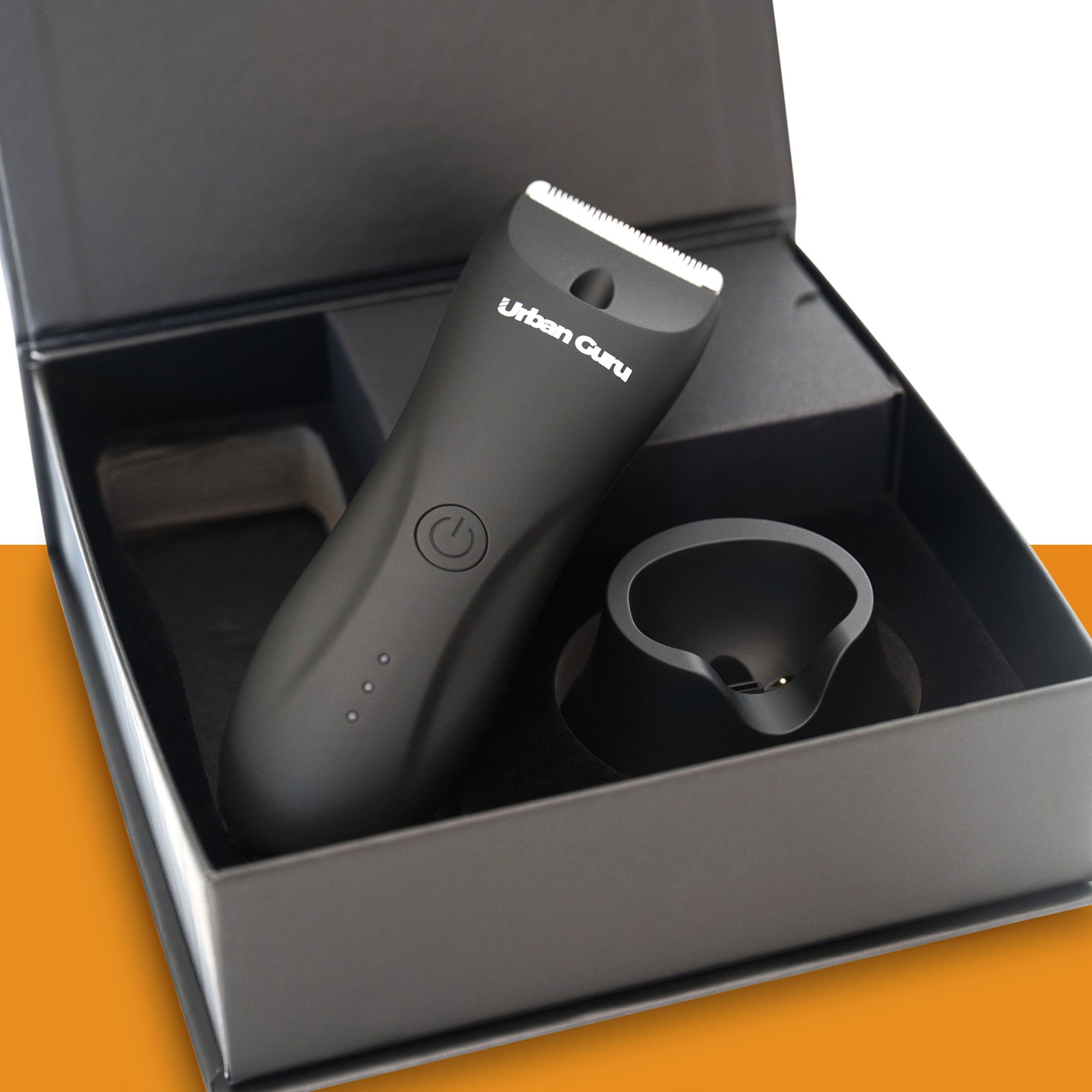 Black grooming tool with 'Urban Groom' branding in an open black box on a white background.